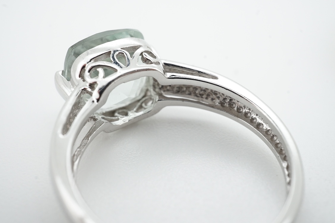 Two modern 9ct gold and gem set dress rings, including chrysoprase and simulated diamond, size J/K, gross weight 6 grams.